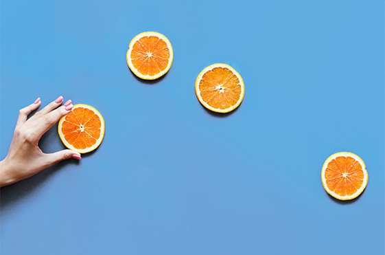 Orange slices on blue surface